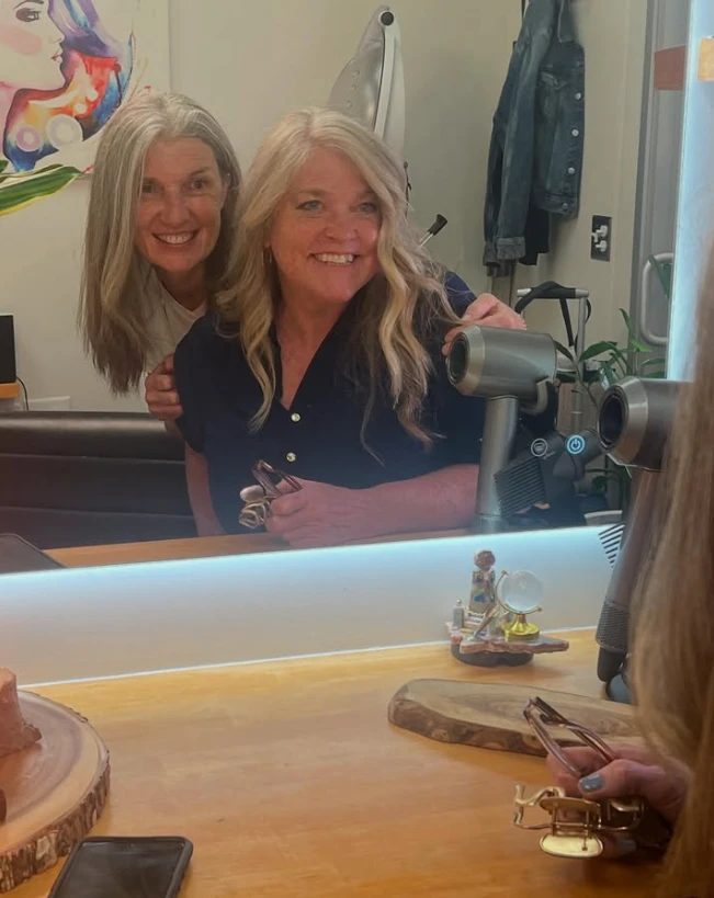 A happy client with a fresh blowout at MW Hair Salon